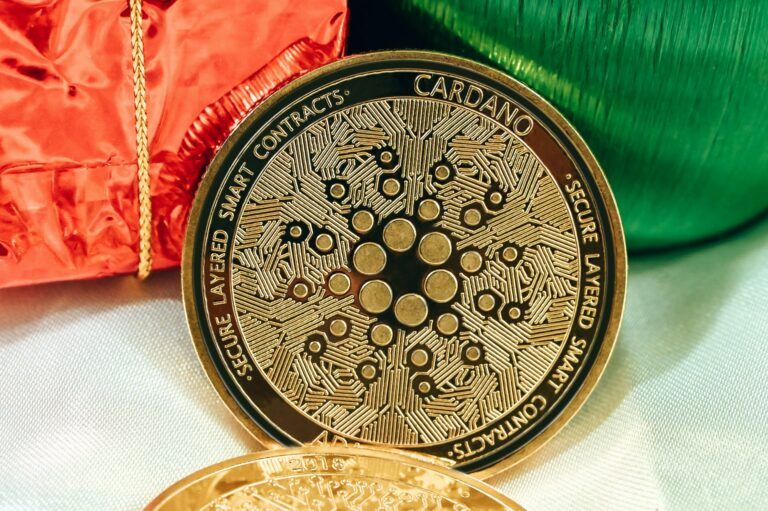 Cardano coin on green red and white background 768x511.jpg