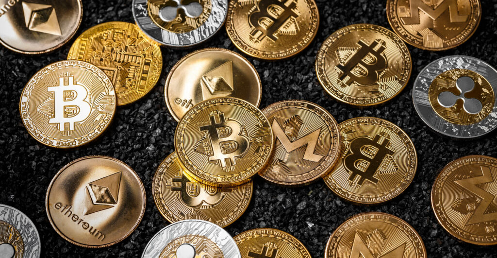 06 Cryptocurrency background with various physical coins 2.jpg