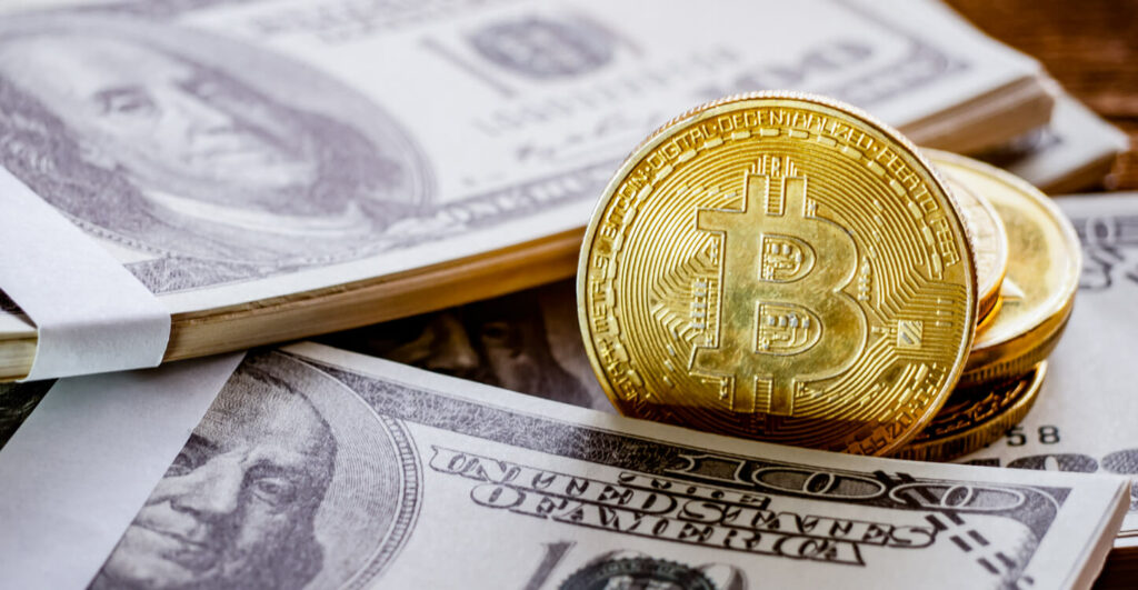 06 US Dollar and Bitcoin placed together to show investment concept.jpg